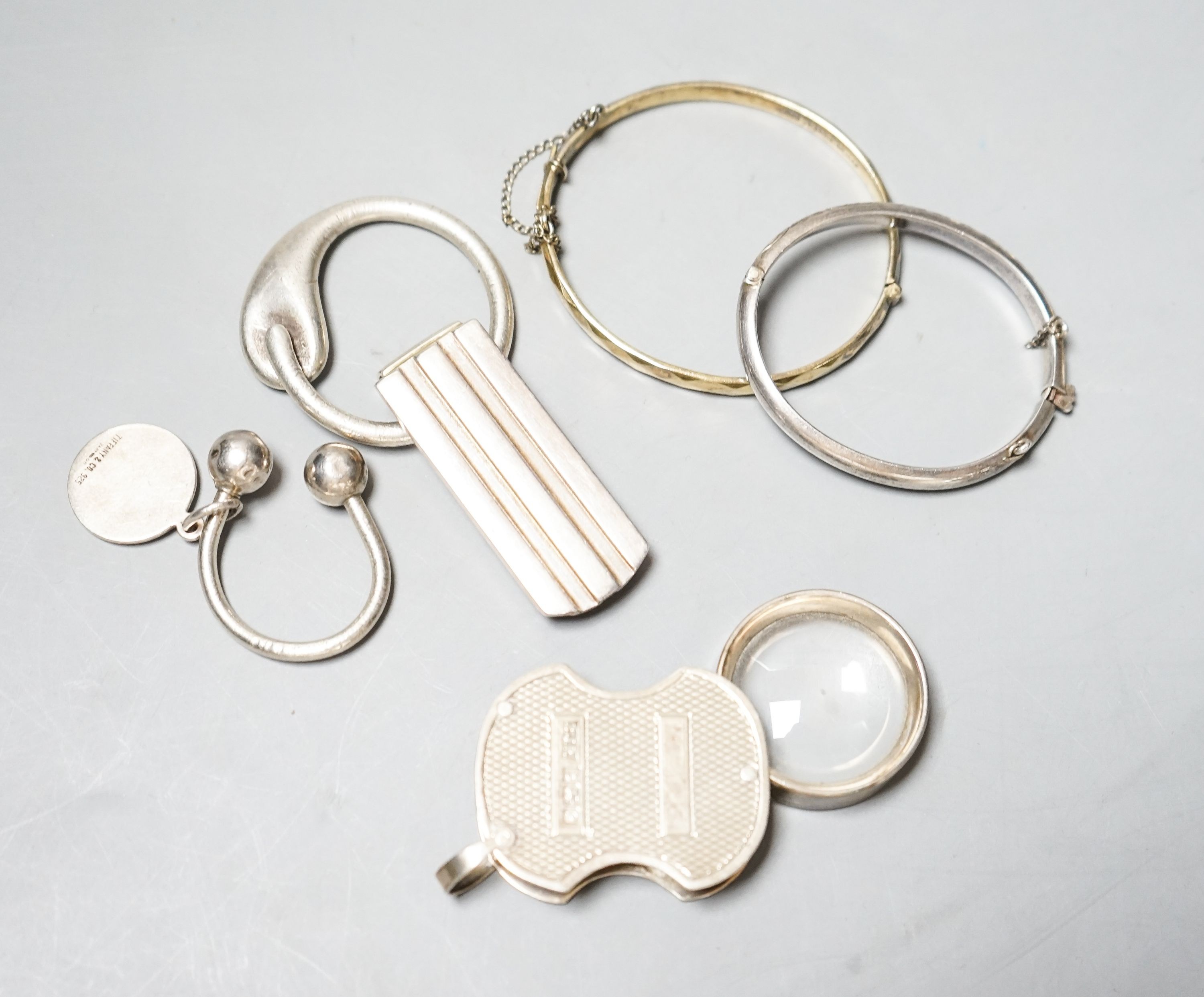 A modern silver mounted eye glass, a 925 Tiffany & Co sterling money clip and three other items.